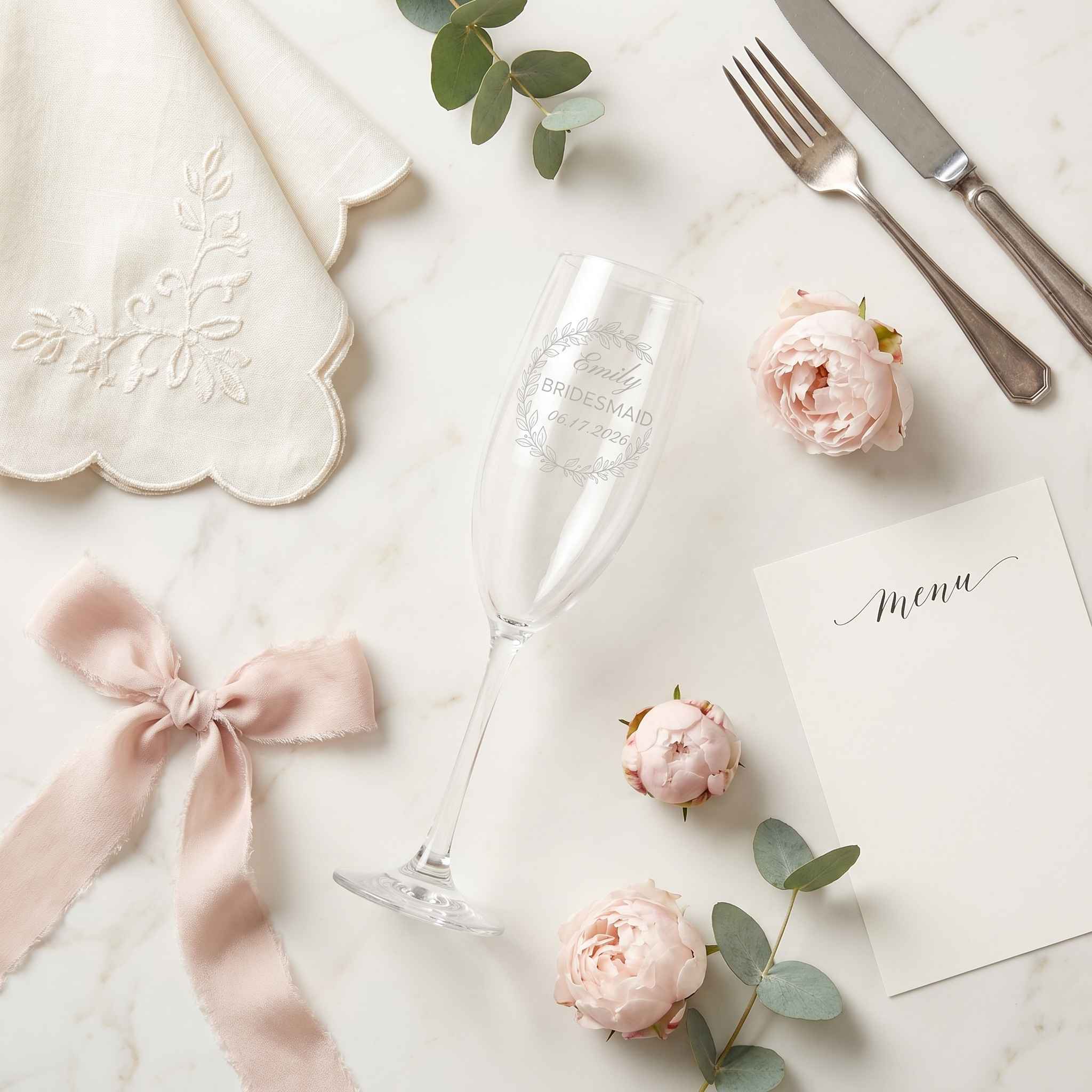 A soft kitchen flatlay with flowers, ceramics, and morning light.